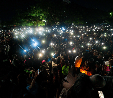Prayer Walk - People with lights in worship